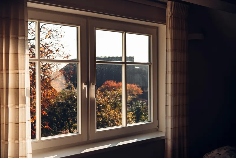 New double-hung windows with white frames in a home interior